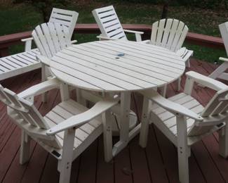   *    Seaside casual furniture company.  There is a  table  and  four chairs. it  is  48" in  diameter.   (as  shown)