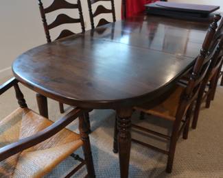 Pine table  with  8  chairs. There  are  eight  chairs with  woven  seats.  The table  has 3 leaves and  pads.  The  table  is 60"  long and 40"  wide.  The leaves are 12" each  if  you  wish  to  increase  the  table size.  sol