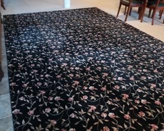 Large rug  9'  6"  x 14" 2".  It  is  a  floral  pattern.