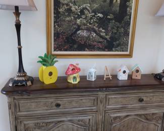 Decor  and   two  lamps  that  match On  top  of  cabinet,