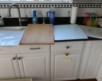 assortment of  cutting  boards   and cookie  sheets