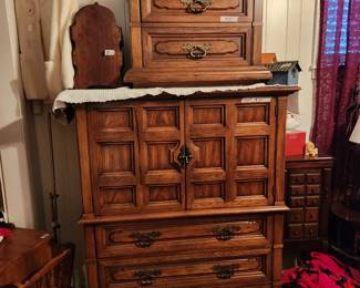 Chest on bottom - top has storage as well as drawers at  bottom, night stand on top of chest & small magazine stand next to night stand. 