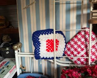 Pillows, artificial flowers, metal headboard & footboard 