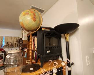 Items on top of heaters includes another Hester, globe on stand large lidded jar with lid & decor