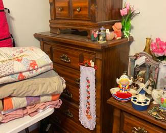 Chest, night stand, quilts on table at left