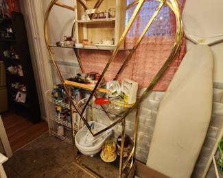 Heart shaped stand with glass shelves in bathroom