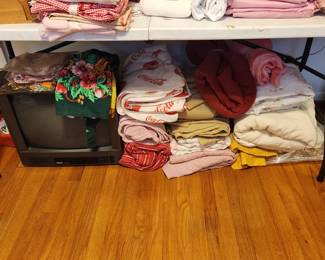 Small TV on left, quilts , comforters, blankets, sheets and anything you might need! 