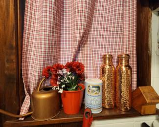 Kitchen - flowers, watering can, tall bottles