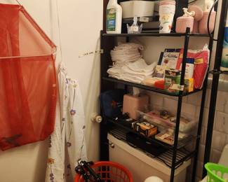 Bathroom - shelves over commode - filled with bathroom items!