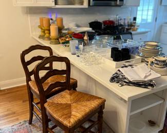 Counter height rush seat stools.