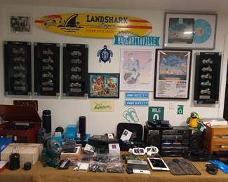 Harley plaques, electronics and Jimmy Buffet fanboy stuff including vinyl records
