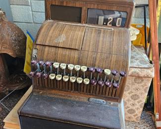 Very heavy and very old cash register door opens when you hit the button and chimes. Also it's 777 cronin avenue. $100