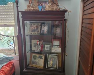 This beautiful miniature display hutch is also at my 777 Cronin House. I've had it for many years it is a miniature hutch roughly 6 ft tall the top piece comes off for easy transportation. The doors are on the sides to open it plus there is storage below mint condition $100