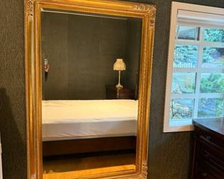Large Gold Framed Beveled Mirror. Dimensions: 69in T | 46in W.