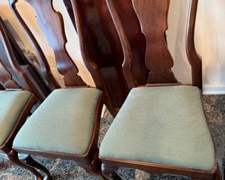 Henredon chairs with green upholstered seats.