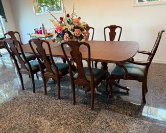Henredon Mahogany Double Pedestal Dining Table, 8 Chairs and Table Top Pads.  Table Dimensions with one leaf extension as shown   is L 92in | H 29in | D 45in. Table comes with 2 - 20in leaves.