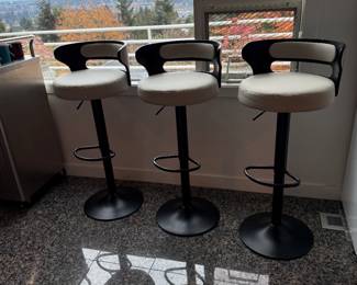 3 Adjustable, Swivel, Lift Bar Stools with Faux Leather cushions.
