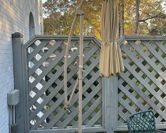 Outdoor Patio Umbrella And Green Statues