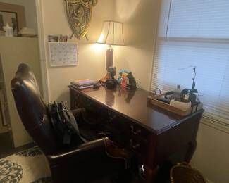 5x7 designer rug and worn desk chair