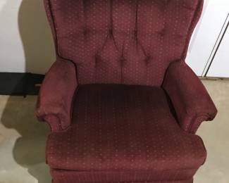Red upholstered chair. Rocks and swivels. 40"H 30"W