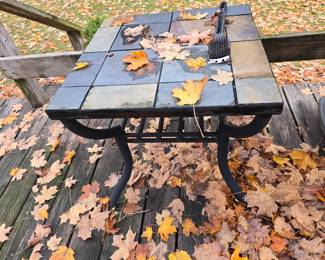 Tile covered metal frame coffee table size table.