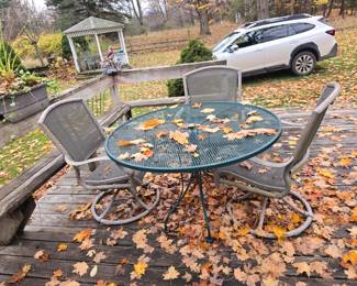There are 4 swivel rockers.  This is the largest outdoor table.  There are a number that are smaller, shorter, etc.  