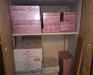 Basement closet full of Suzanne Gibson dolls, including two of the 1982 Mother Goose sets.