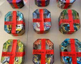 9 tins full of Pokemon Cards