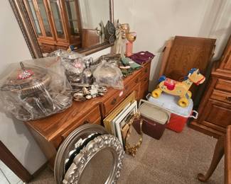 Silver plated serving dishes, silverware and lots of mirrors