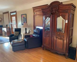 Black Leather Recliner, Carved Mirrored Armoire