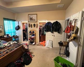 Motorcycle jackets, designer clothing with the new tags still on, lots of fancy purses… tons of nice jeans & an offering of Nikes & fancy shoes the likes of which we’ve never seen!