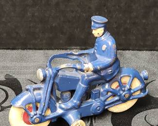 Cast iron toy motorcycle police officer