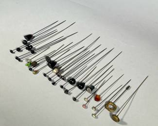 HAT PIN COLLECTION | Vintage hat pins, including an art nouveau-style flower pin, a brass eagle and shield, an engraved metal knot, ebonized wood, faux pearl and gemstones, and others -  l. 9.25 in (longest)