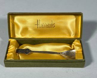 HARRODS STERLING SPOON | Sterling souvenir demitasse spoon in a conforming silk-lined box, the handle showing the Harrods Knightsbridge building; spoon l. 4.75; weight 0.39 ozt -  l. 5.5 in (box)
