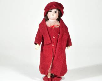 Antique German Porcelain Head Doll | Porcelain head, natural hair, in red wool clothing; accompanied by a display case. - h. 14 in

