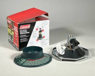 NIB COLEMAN BOTTLE TOP STOVE | Coleman propane-powered bottle top stove with adjustable burner, large base, and wind baffles. - h. 6.5 x w. 7.5 x l. 7.75 in (box)
