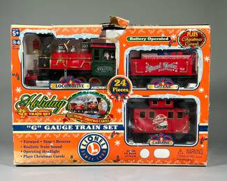 LIONEL HOLIDAY TRAIN SET | Vintage Lionel G Gauge train set, no. 62060, battery operated with locomotive, gift car, and caboose. 

