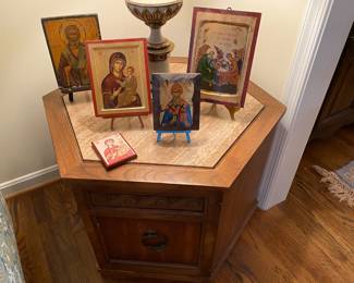 Religious icons on five-sided table.