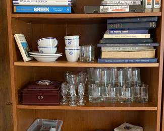 Bookshelves with assorted Navy memorabilia.