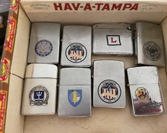 Assorted Navy lighters.