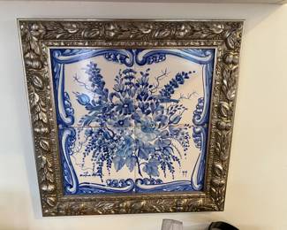 Framed blue and white tile.