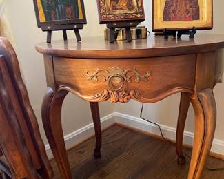 Religious icons on Baker Furniture French court side table.
