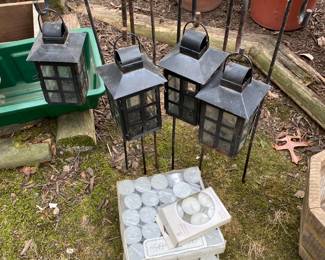 Hanging lights and garden items.