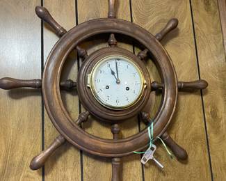 Vintage antique wood and brass porthole ship wheel wall clock.