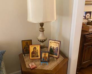 Religious icons on five-sided side table.
