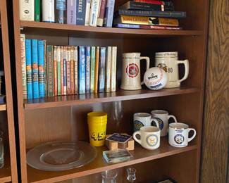 Bookshelves with assorted Navy memorabilia.