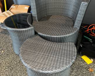 Wicker armchair with side table and ottoman