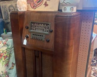 1930s radio, mcm lamp, antique oil painting of abstract butterflies.