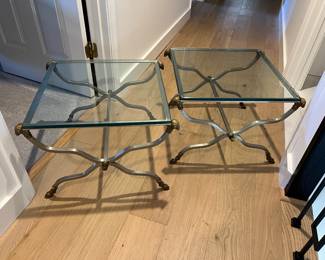 Pair of metal and glass side tables with ram’s head detail