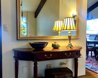 Vintage cherry console, large gold framed mirror, two woven wicker chests